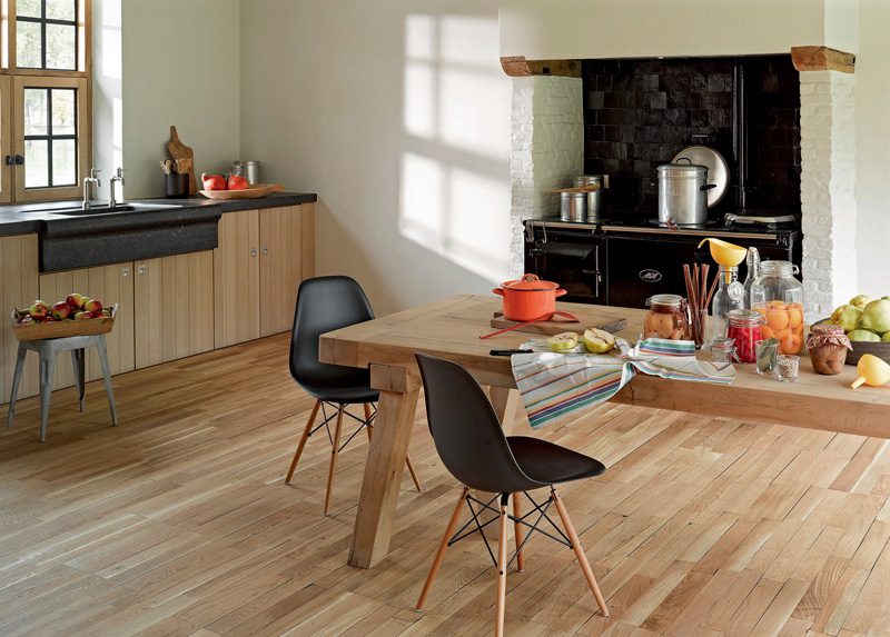 Dining area with light wood-look plank flooring